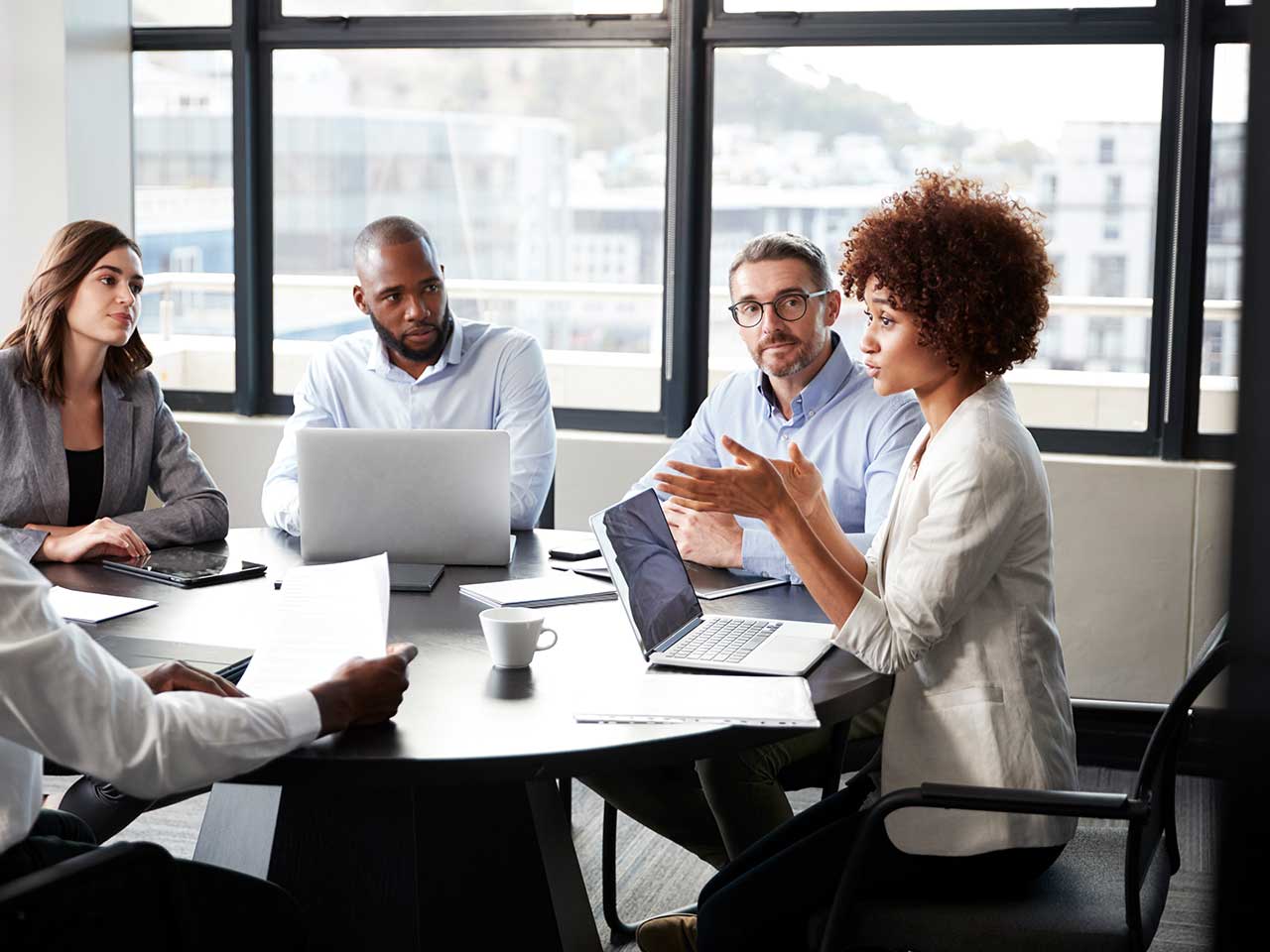Advisors meeting as a team to discuss client planning and investment strategy