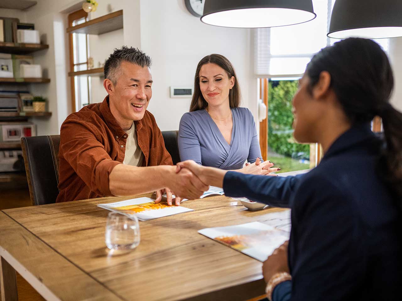 Advisor meeting with a couple to discuss investment priorities and financial goals