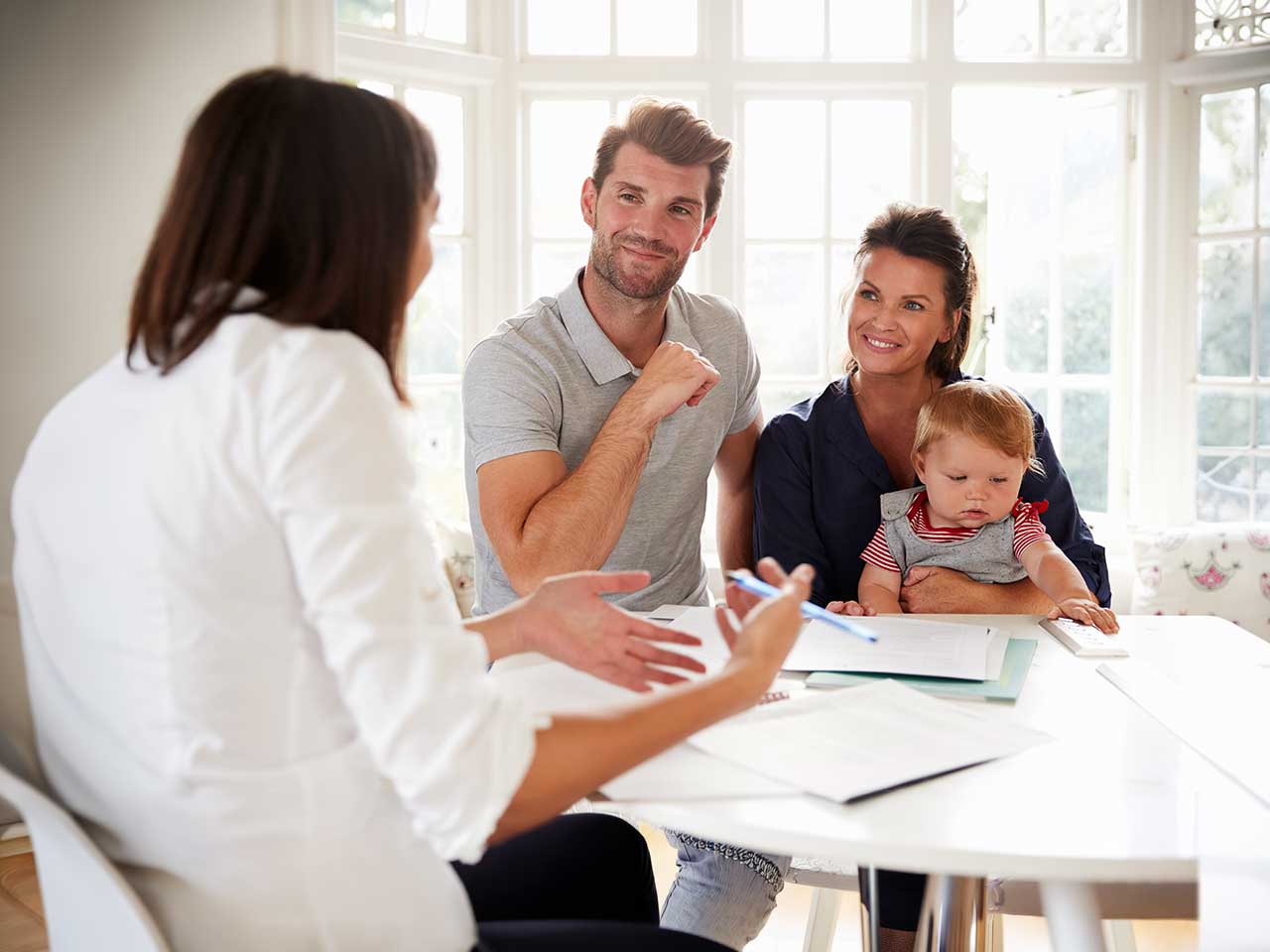 Financial consultant discussing education savings accounts and 529 plans with a family