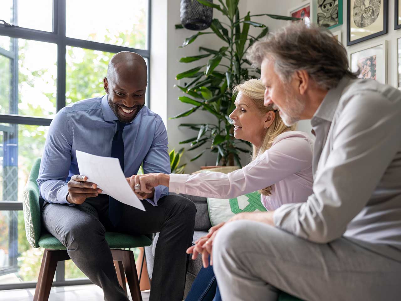Couple discussing retirement timeline and income needs with their financial advisor