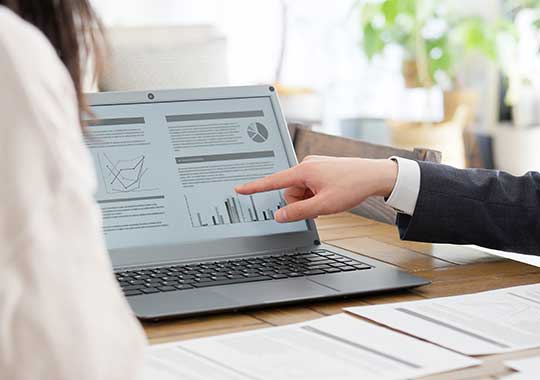 Client and advisor reviewing a rollover checklist and account statements