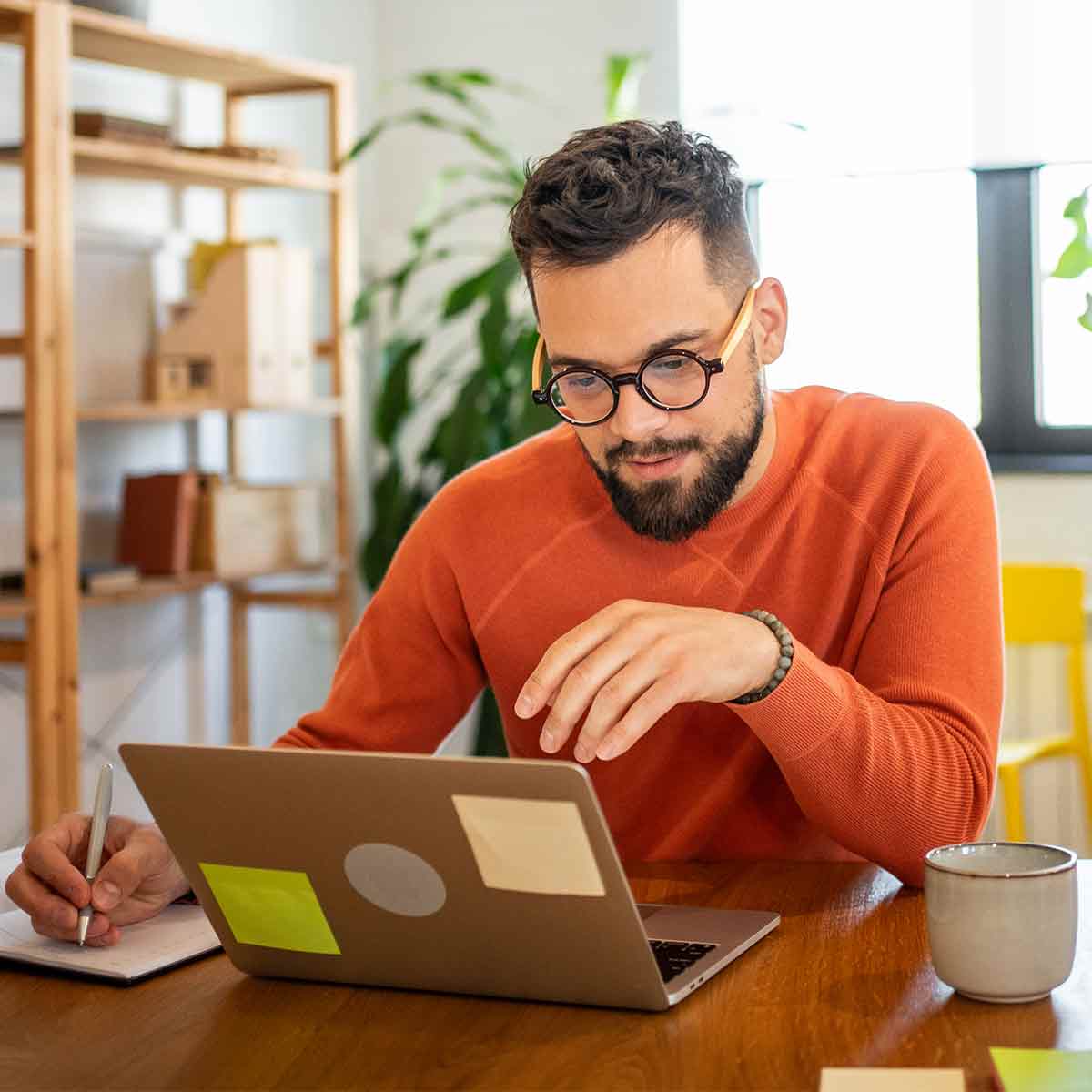 man-reviewing-budget-on-laptop