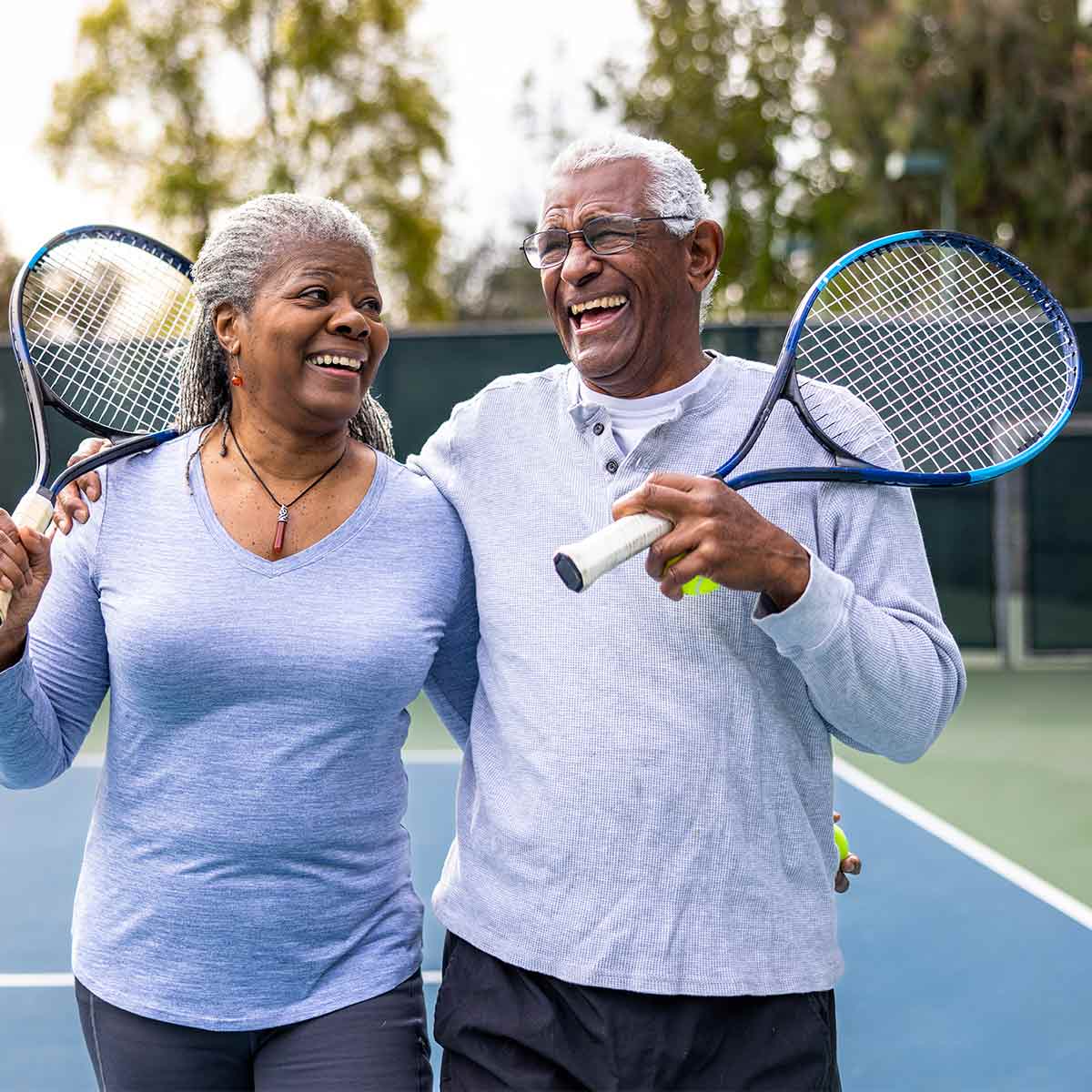 retired-couple-playing-tennis
