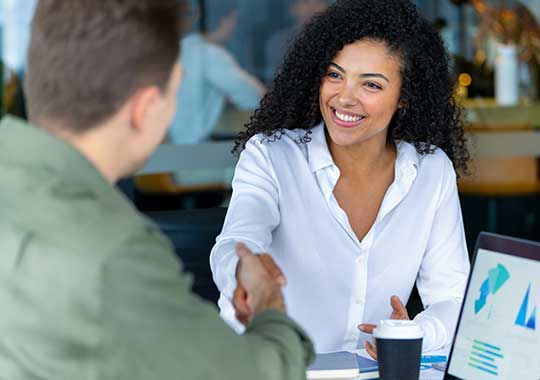 Advisor team collaborating on a client plan in an office setting