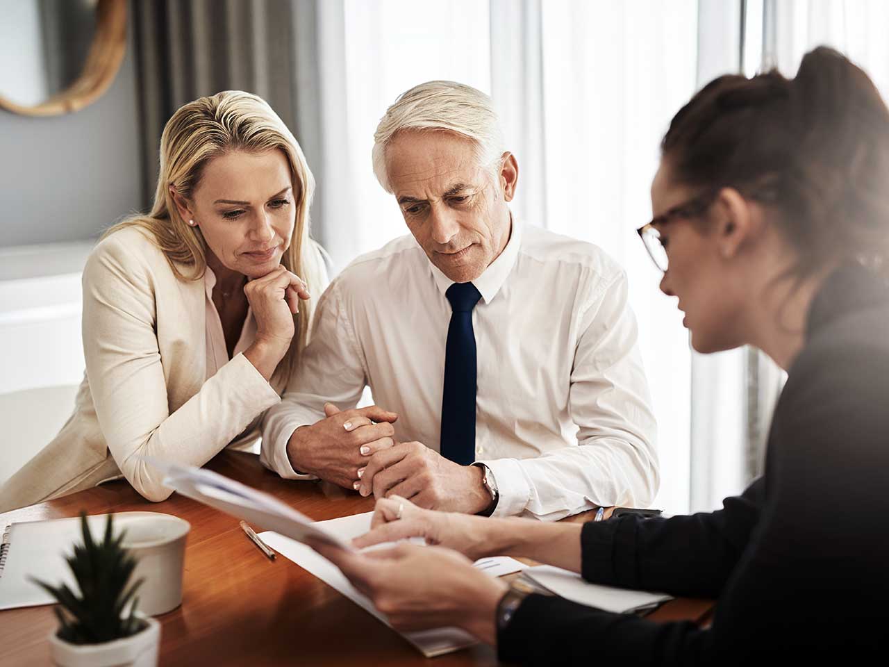 Advisor reviewing a consolidated financial overview with a client