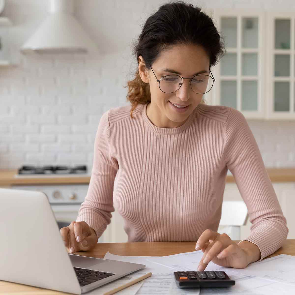 woman-calculating-interest-in-kitchen